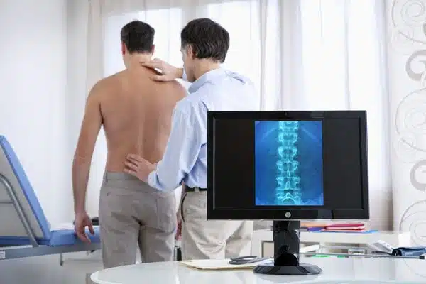 man having a checkup to his back